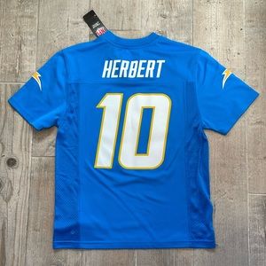 Brand  new never been worn tags on Justin Herbert youth medium jersey.